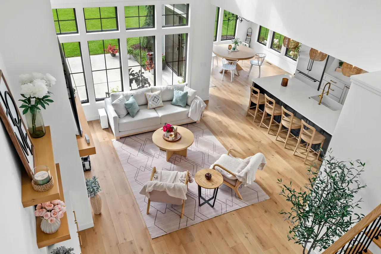 Elevated interior view of a double-height living area and adjoining kitchen